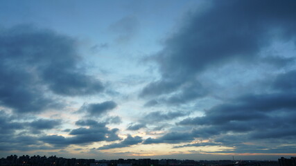The beautiful sunset sky view with the colorful clouds and blue background