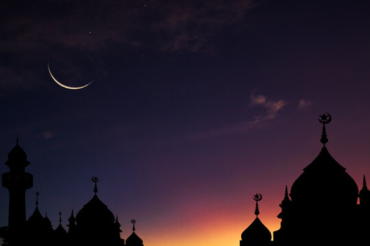 Crescent moon on twilight sky after sundown over dome mosques,Eid al-Adha, Eid al-Fitr