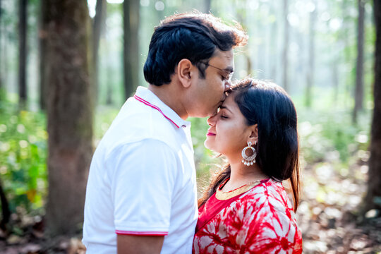 Young couple in a intimate moment in forest