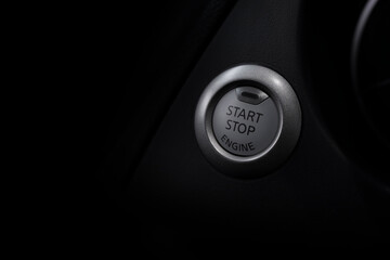 car engine star and stop button with soft-focus and over light in the background