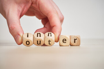 Concept of antonym inner and outer on wooden blocks