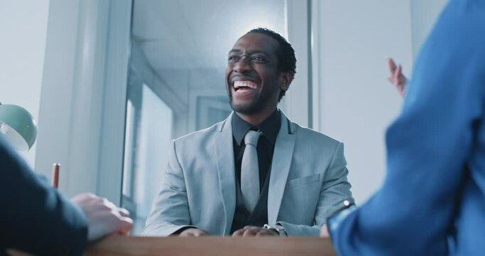African businessman smiling during job interview