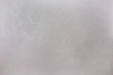 Texture of a grey stone decorative plaster or concrete wall.