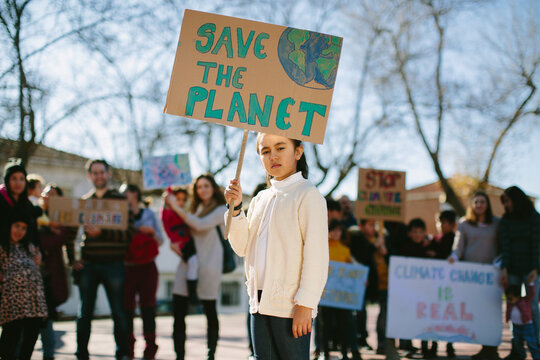 Young girl carrying a banner