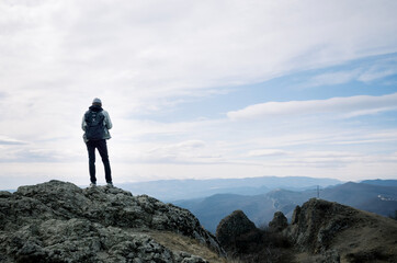 Young man on the top of the hill