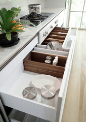 Naklejka na ściany i meble Modern kitchen, Open drawers, Set of cutlery trays in kitchen drawer. Solid oak wood cutlery drawer inserts.