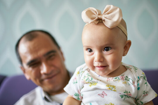 Grandpa having a good time his 8 month old grandchild