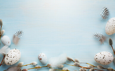 art Tender Easter greetings banner or card background with decoration Easter eggs and pussy willow on blue wooden vintage planks © Konstiantyn