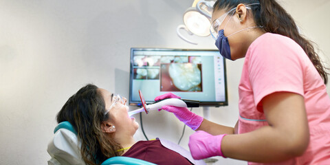 Dentist office: Dentist doing whitening