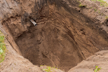 Deep pit in the ground on a close-up construction site