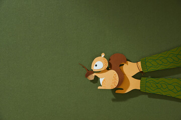 The charming little squirrel on the hands.