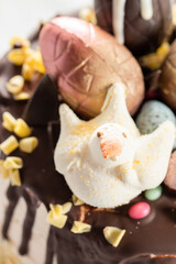 Obraz na płótnie Canvas Easter drip cake with chocolate and egg decoration