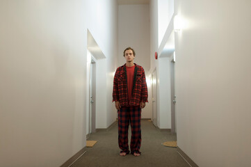 Young man in empty Hallway