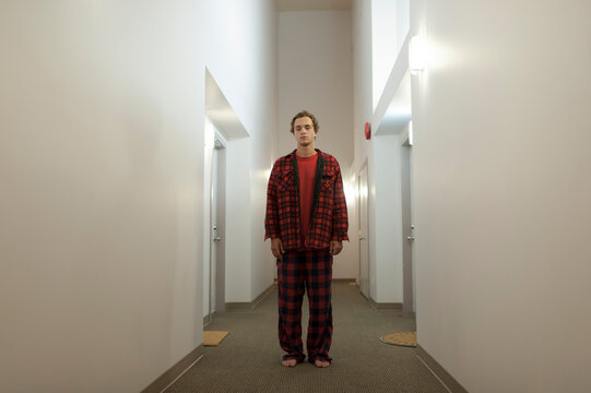 Young man in empty Hallway