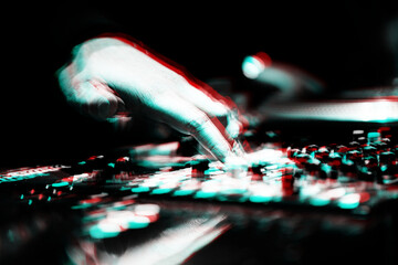 Concert dj plays music in nightclub.Disc jockey playing musical tracks on stage,edited with stereo...