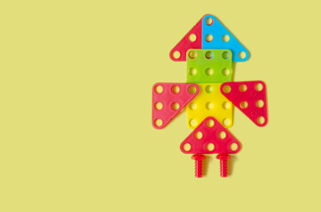 Rocket from a children's constructor on a yellow background