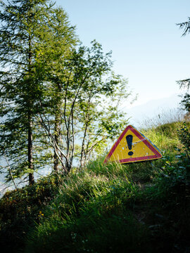 A yellow warning sign in the mountain