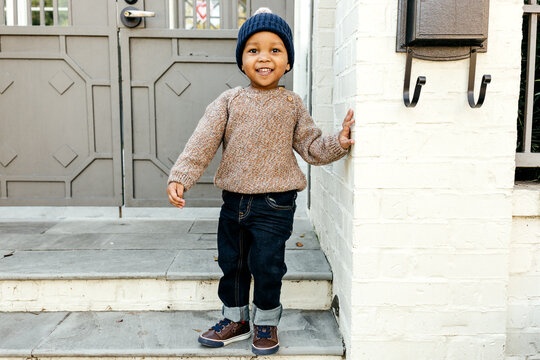 Adorable boy toddler wearing fashionable Fall clothes