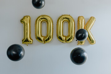100k Number Gold Balloons with Black Balloons