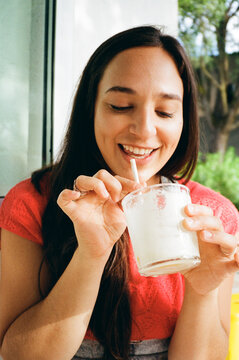 happy female with cocktail