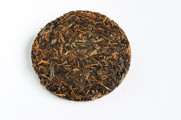 Chinese pressed pu er tea on white background  close-up	