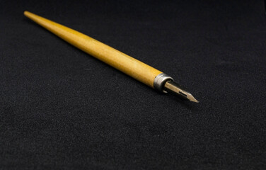 Wooden pen-pen holder with a pen.