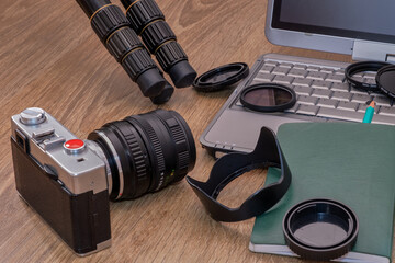 Composition, photo camera with various photographic objects.