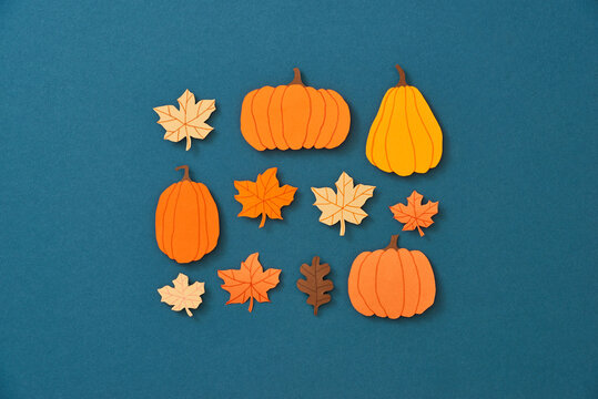 Autumn background with yellow maple leaves, pumpkins