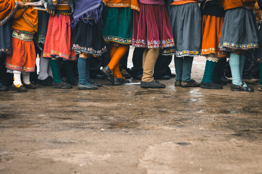 Group of andean girls wearing traditional skirts and long socks