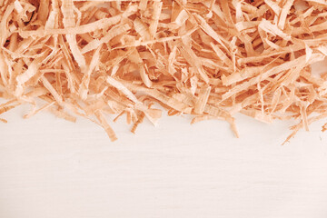 Wood shavings on white background. Top view. Copy, empty space for text