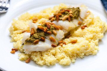 cod with green pesto and pine seeds with couscous