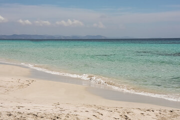 a sunny day at the beach with turquoise water