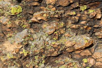 Weathered Rocks Background with Lichen Full Frame of Cliff 