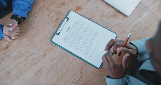 Close up of a recruiter handing over a contract to candidate 