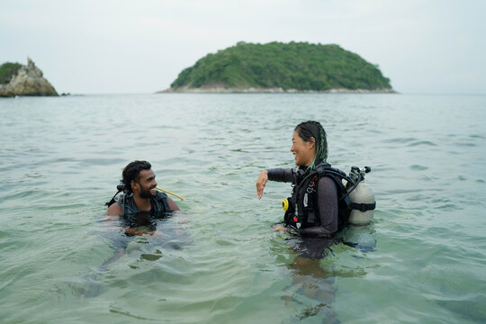 Two divers taking before diving in
