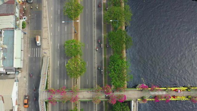 Beautiful aerial 4K footage of riverside highway traffic in Ho Chi Minh city