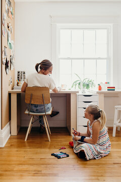 Mom Working From Home with Daughter