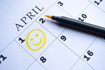 The date of April 1 is circled on the calendar. April Fool's Day - obrazy, fototapety, plakaty
