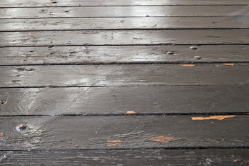 Weathered rustic and grungy black plank from table in perspective view