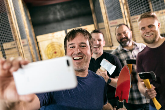 Axe Throwing Guys Get A Selfie Photo Together