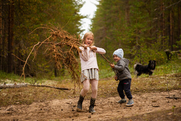 girl and boy in the woods, selective focus