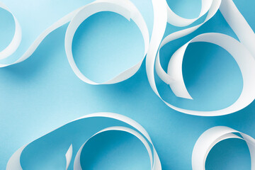 White paper curls on light blue, texture  background