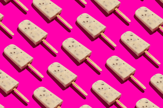 Vanilla ice pops on pink