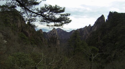 China Mount HuangShan - April, 2015: Natural scenery, sunsets, peculiarly-shaped granite peaks, Huangshan pine trees and views of the clouds from above. Photo taken in Yellow Mountain (UNESCO).