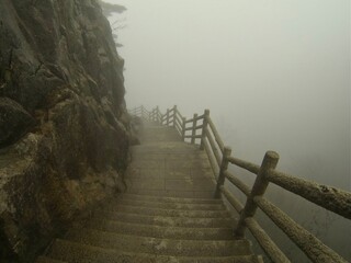 China Mount HuangShan - April, 2015: Natural scenery, sunsets, peculiarly-shaped granite peaks, Huangshan pine trees and views of the clouds from above. Photo taken in Yellow Mountain (UNESCO).