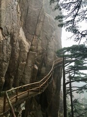 China Mount HuangShan - April, 2015: Natural scenery, sunsets, peculiarly-shaped granite peaks, Huangshan pine trees and views of the clouds from above. Photo taken in Yellow Mountain (UNESCO).