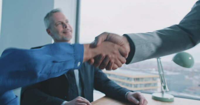 Female recrutier shake hand with male candidate