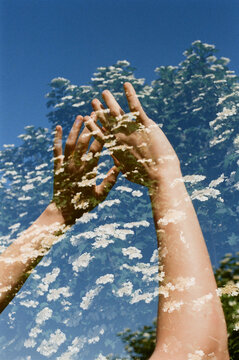Double exposure shot of woman&rsquo;s hands