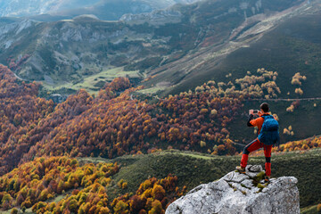 Unrecognizable hiker shooting with phone fall highlands