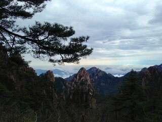 China Mount HuangShan - April, 2015: Natural scenery, sunsets, peculiarly-shaped granite peaks, Huangshan pine trees and views of the clouds from above. Photo taken in Yellow Mountain (UNESCO).